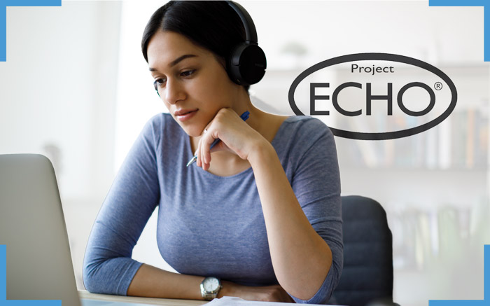 a woman watching a project echo series on her laptop