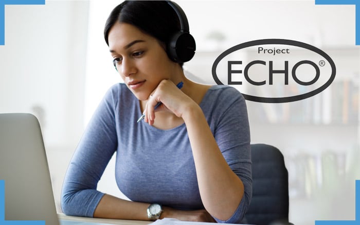 a woman watching a project echo series on her laptop