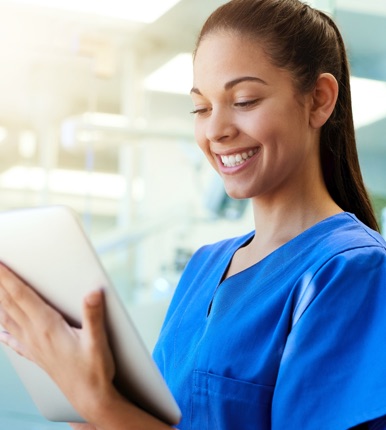 Nurse holding a tablet and typing